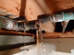 water leak caused by a broken pipe